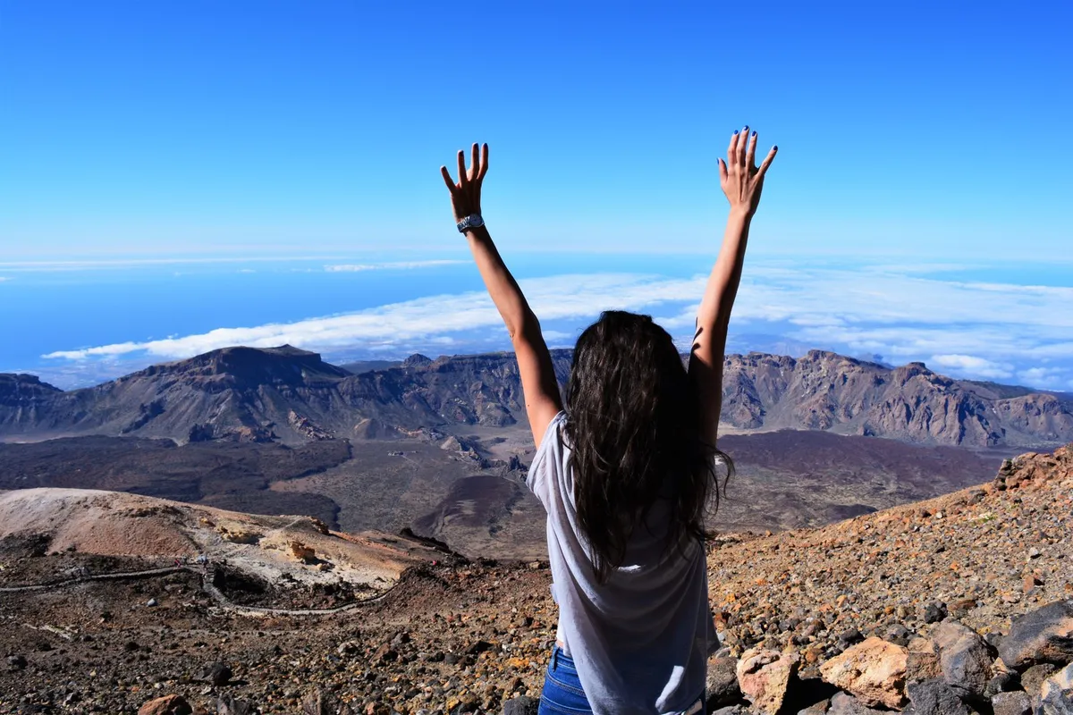 The view from high on Mount Teide over the caldera floor with the cloud sea on the horizon